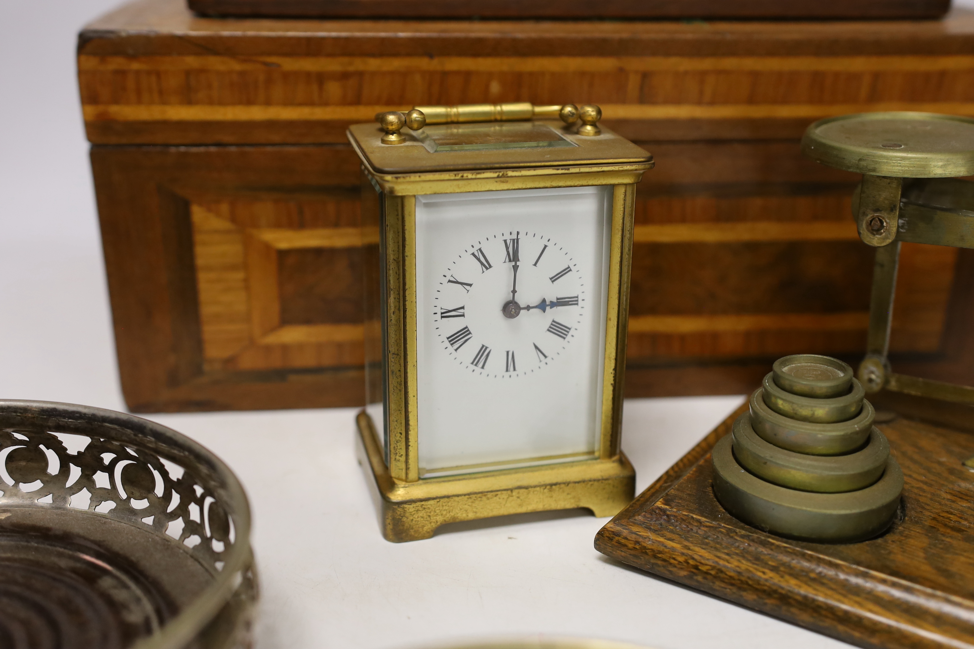 Letter scales and weights, a inlaid box, a carved box, a pair of plated coasters, carriage clock, inlaid box 33cm wide x 13cm high